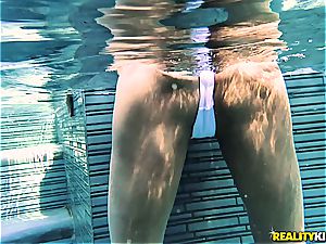 big-titted swimsuit babe heads deep anal invasion with a binding stud